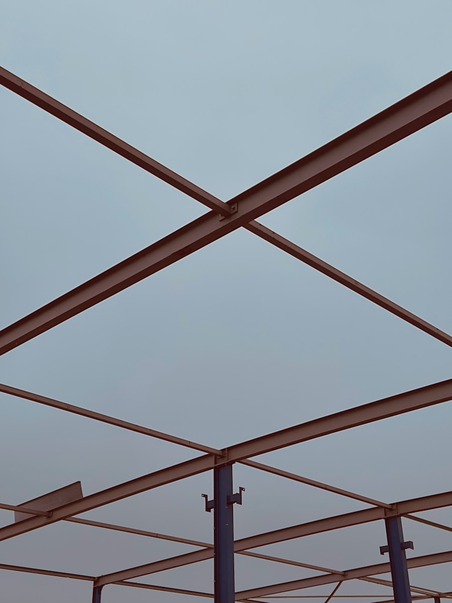 Steel beams forming a geometric structure against sky